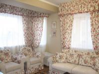 Curtains with a floral print in the interior of the kitchen, bedroom and living room Curtains in a flower for the room